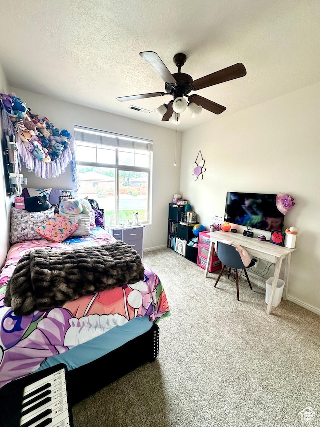 bedroom featuring a textured ceiling, ceiling fan, baseboards, carpet flooring, and visible vents