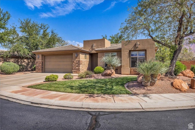 240 W 225 S, Ivins, UT 84738 - view of front of home featuring stucco siding, a garage, driveway, and stone siding