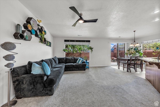 240 W 225 S, Ivins, UT 84738 - carpeted living area with a textured ceiling, a ceiling fan, and a chandelier