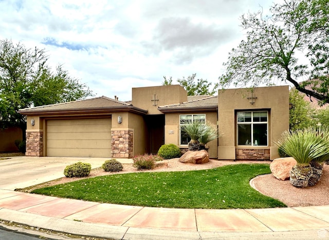 view of front facade featuring a garage, driveway, stone siding, and stucco siding