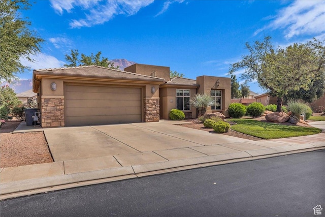 240 W 225 S, Ivins, UT 84738 - view of front of house featuring stone siding, a garage, stucco siding, and driveway
