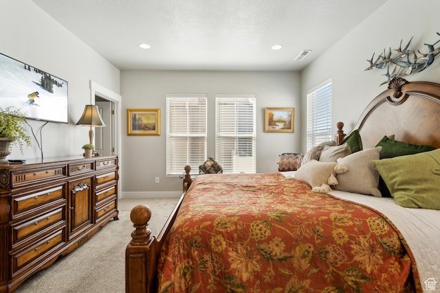 bedroom with recessed lighting, visible vents, baseboards, and light carpet