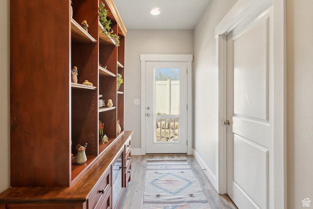 mudroom with recessed lighting, baseboards, and light wood-style flooring