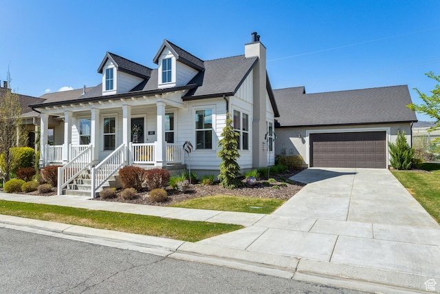 view of front of home featuring a chimney, concrete driveway, an attached garage, a porch, and roof with shingles