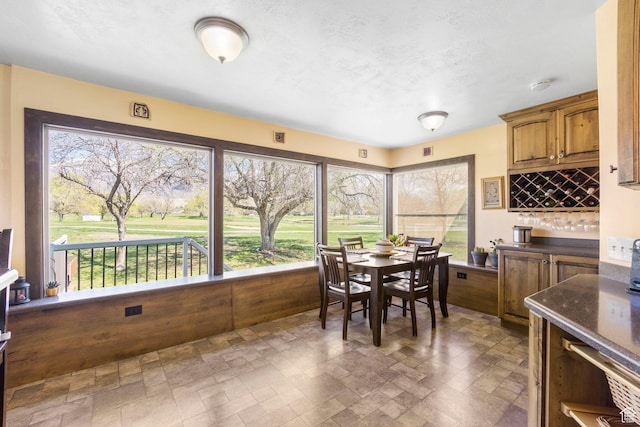 dining space featuring stone finish floor