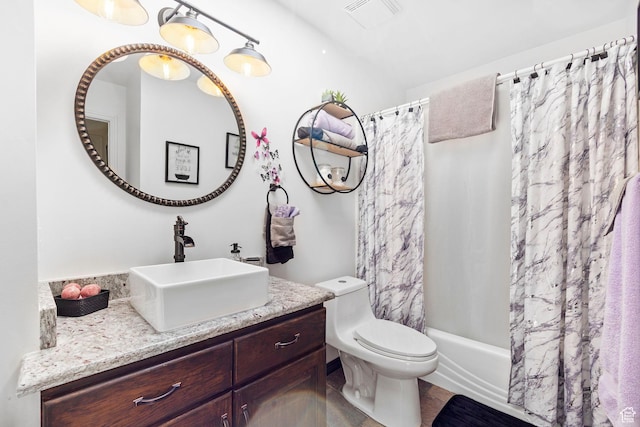 full bathroom featuring toilet, visible vents, shower / tub combo, and vanity