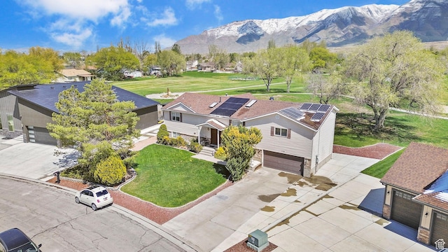 bird's eye view featuring a residential view and a mountain view