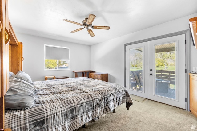 bedroom with french doors, ceiling fan, access to outside, and light colored carpet