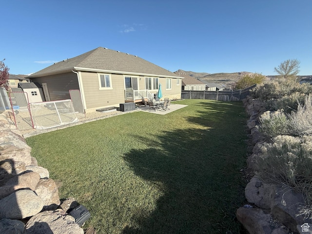 9104 N Cornwall Way E, Eagle Mountain, UT 84005 - back of house with a patio area, cooling unit, a storage unit, and an outdoor structure