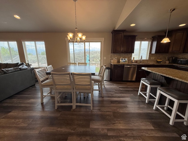 9104 N Cornwall Way E, Eagle Mountain, UT 84005 - dining area featuring dark wood-type flooring, a chandelier, recessed lighting, and vaulted ceiling