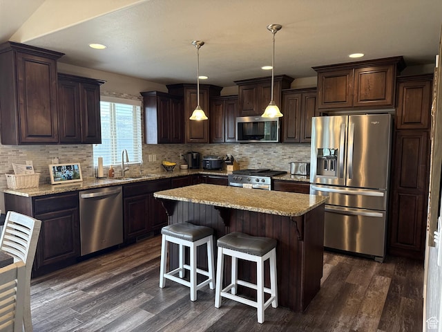 9104 N Cornwall Way E, Eagle Mountain, UT 84005 - kitchen with stainless steel appliances, a sink, dark brown cabinets, dark wood-type flooring, and recessed lighting