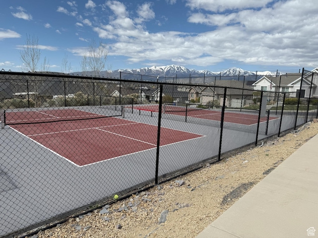 9104 N Cornwall Way E, Eagle Mountain, UT 84005 - view of tennis court featuring fence and a mountain view