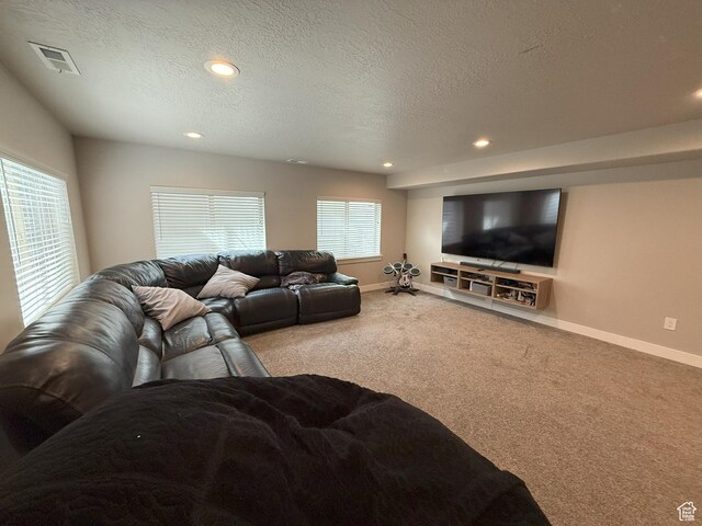 9104 N Cornwall Way E, Eagle Mountain, UT 84005 - carpeted living room featuring baseboards, recessed lighting, and a textured ceiling