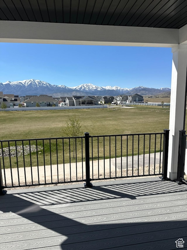 7877 Walnut Dr Unit 303, Eagle Mountain, UT 84005 - wooden terrace featuring a residential view, a yard, and a mountain view