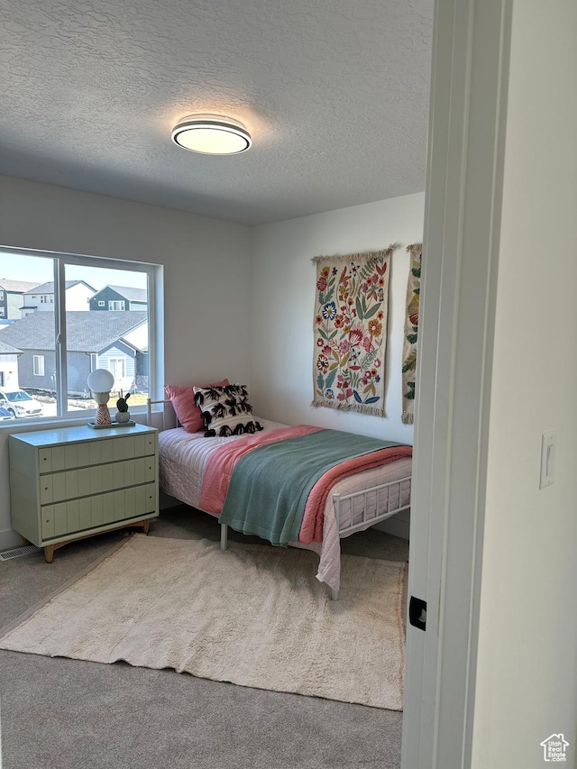 7877 Walnut Dr Unit 303, Eagle Mountain, UT 84005 - carpeted bedroom with a textured ceiling