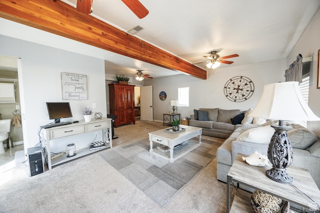 living room featuring visible vents, beam ceiling, ceiling fan, and light colored carpet