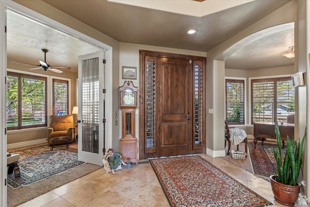 6109 S Vine Bend Ln, Murray, UT 84121 - foyer with recessed lighting, arched walkways, a ceiling fan, and baseboards