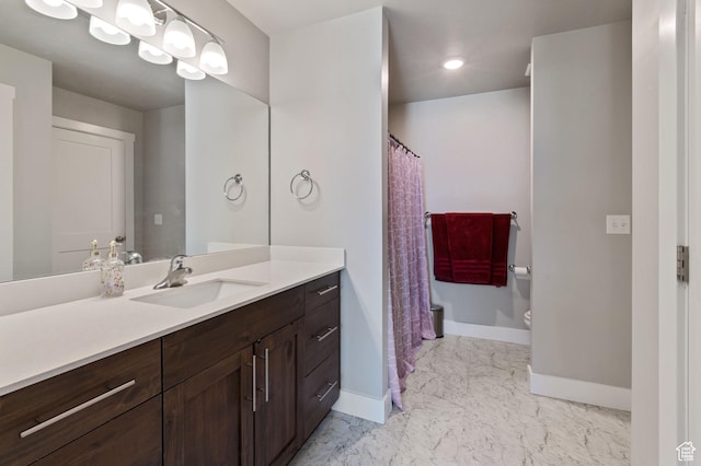 2636 S 2250 W Unit 124, West Haven, UT 84401 - full bathroom with baseboards, marble finish floor, vanity, and toilet