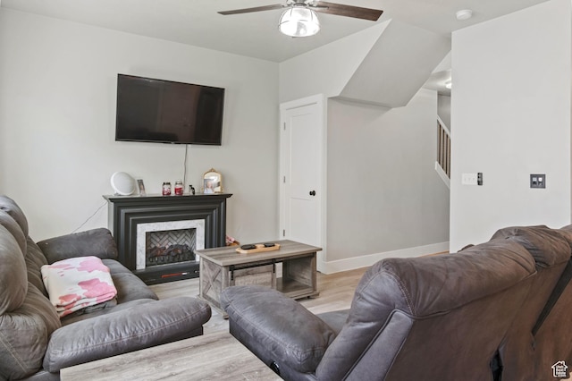 2636 S 2250 W Unit 124, West Haven, UT 84401 - living room with baseboards, wood finished floors, stairway, ceiling fan, and a fireplace