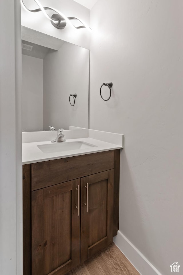 2636 S 2250 W Unit 124, West Haven, UT 84401 - bathroom with visible vents, baseboards, wood finished floors, and vanity