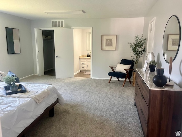 85 E 100 N, Redmond, UT 84652 - bedroom with visible vents, connected bathroom, a closet, baseboards, and light colored carpet