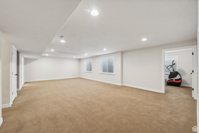 basement with recessed lighting, baseboards, and light colored carpet