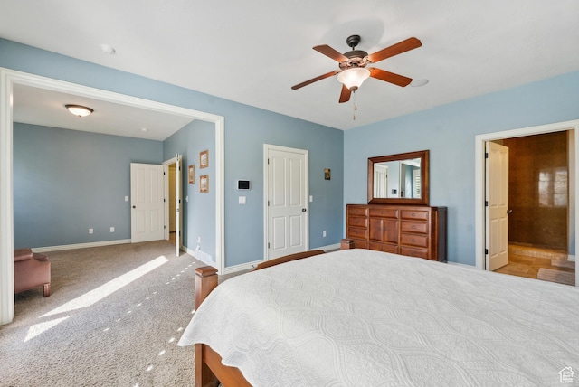 carpeted bedroom with baseboards and a ceiling fan