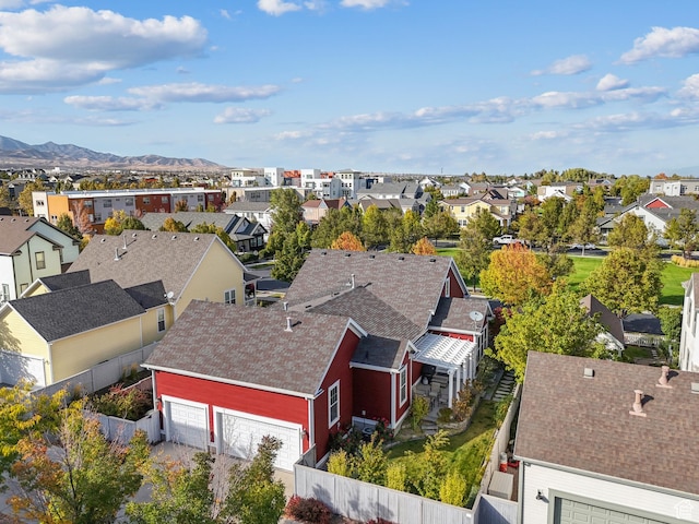 drone / aerial view featuring a residential view and a mountain view