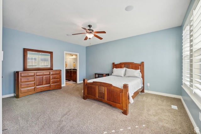 carpeted bedroom featuring baseboards, a ceiling fan, and multiple windows