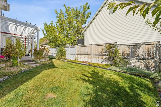 view of yard featuring a pergola and fence