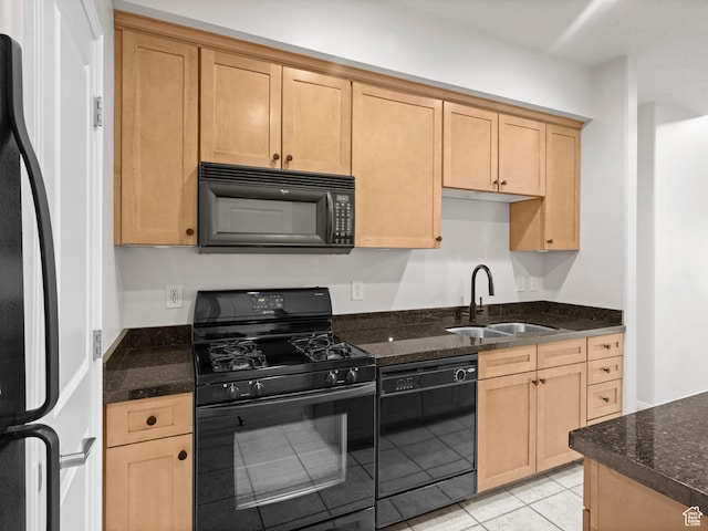 5 S 500 W Unit 311, Salt Lake City, UT 84101 - kitchen featuring a sink, dark stone countertops, black appliances, and light tile patterned flooring