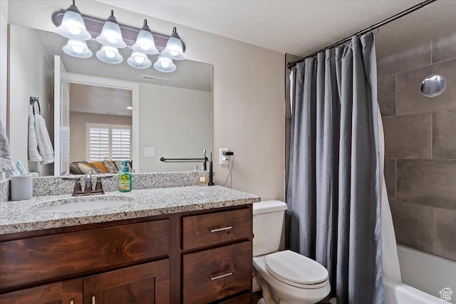 bathroom featuring visible vents, toilet, vanity, shower / tub combo with curtain, and a chandelier