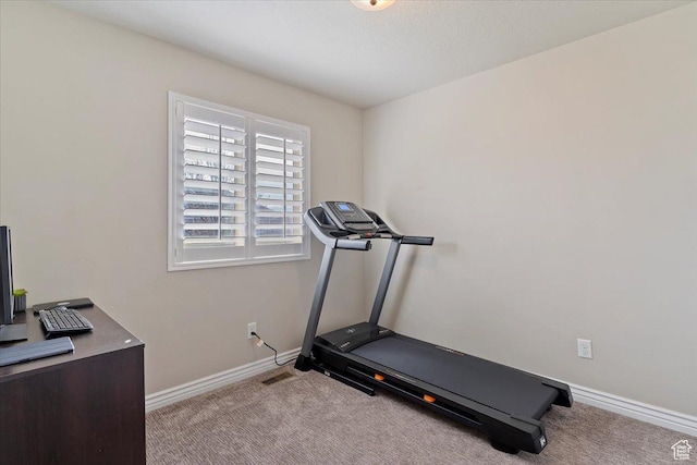exercise area with carpet floors, visible vents, and baseboards