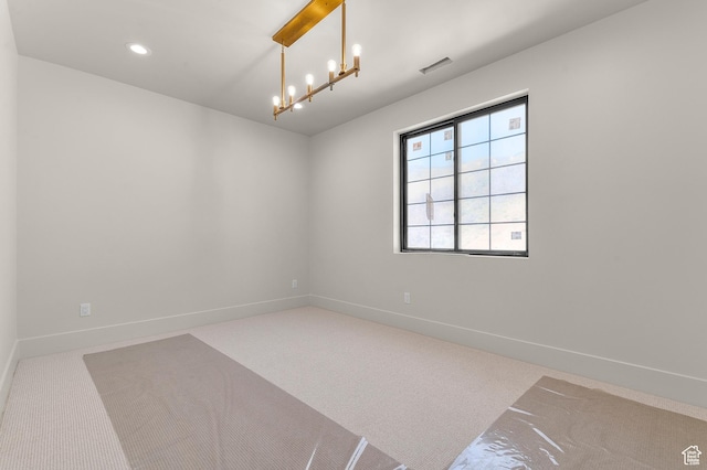 empty room with baseboards, carpet flooring, visible vents, and recessed lighting