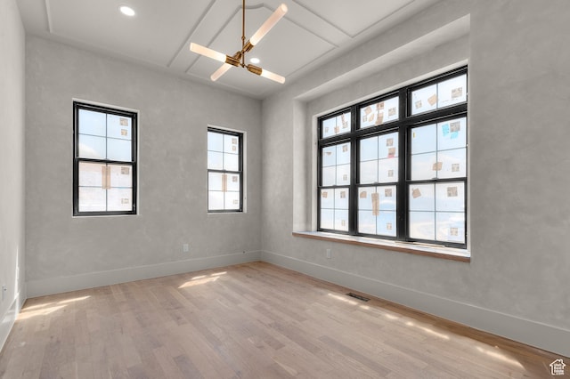 unfurnished room featuring ceiling fan, baseboards, light wood-style floors, and visible vents