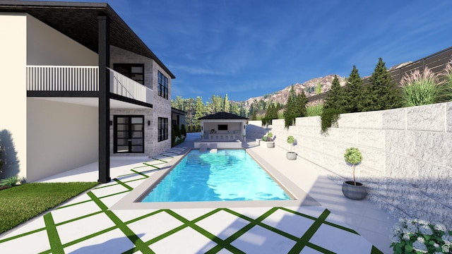 view of pool with a fenced in pool, a patio, fence, and a mountain view