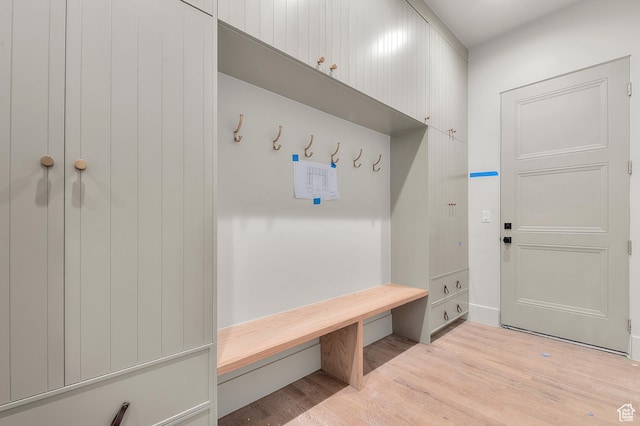 mudroom with light wood-style flooring