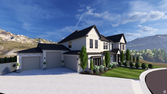 view of side of property with concrete driveway, a lawn, a shingled roof, an attached garage, and a mountain view