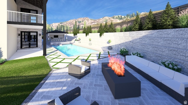 view of swimming pool with a fenced backyard, a mountain view, a patio, and a fenced in pool