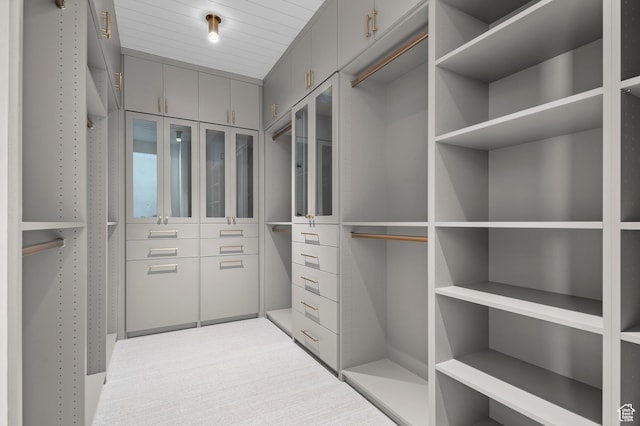 walk in closet featuring carpet