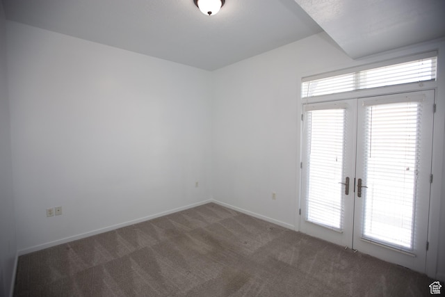 2150 S Main St Unit 514, Salt Lake City, UT 84115 - unfurnished room featuring carpet floors, baseboards, and french doors