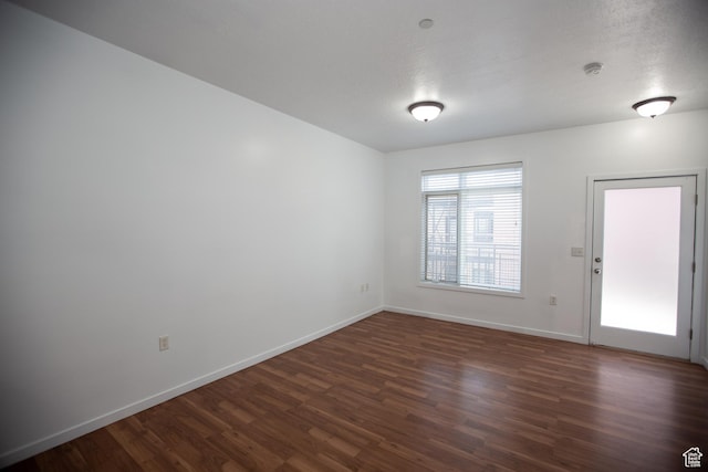 2150 S Main St Unit 514, Salt Lake City, UT 84115 - spare room featuring dark wood finished floors and baseboards