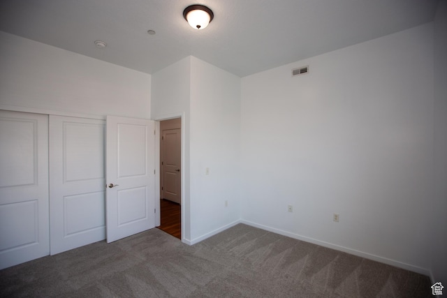 2150 S Main St Unit 514, Salt Lake City, UT 84115 - unfurnished bedroom featuring baseboards, carpet flooring, visible vents, and a closet