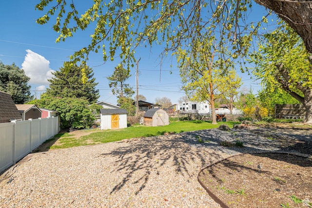 2005 N 500 E, North Ogden, UT 84414 - view of yard with a fenced backyard, an outdoor structure, and a storage shed