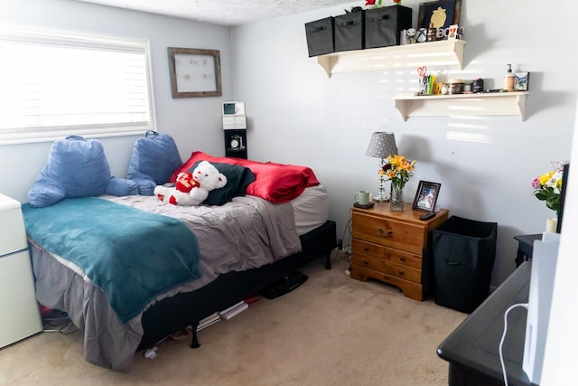 bedroom featuring fridge and carpet