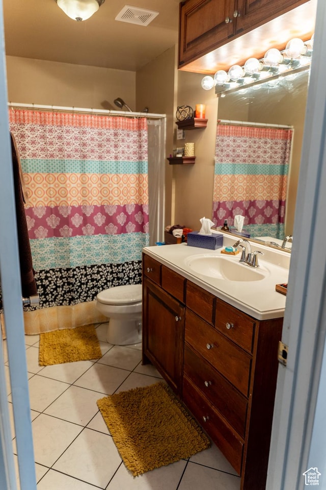 full bath with visible vents, tile patterned floors, vanity, and toilet