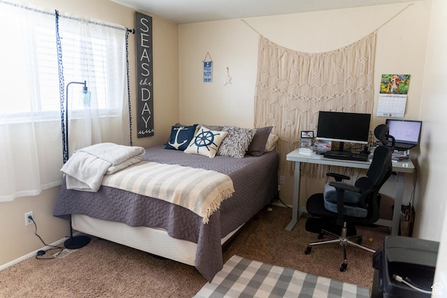 bedroom featuring baseboards and carpet floors