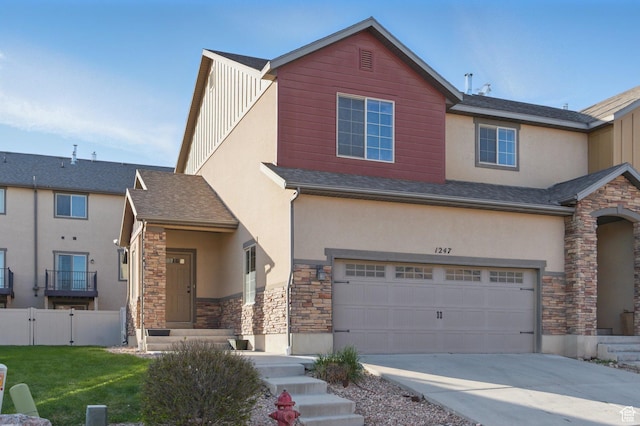 1247 N Baycrest Dr, Saratoga Springs, UT 84045 - view of front of home featuring driveway, stone siding, fence, a garage, and stucco siding