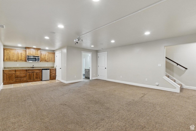 1247 N Baycrest Dr, Saratoga Springs, UT 84045 - unfurnished living room featuring light colored carpet, baseboards, and recessed lighting