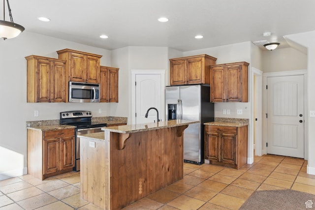 1247 N Baycrest Dr, Saratoga Springs, UT 84045 - kitchen featuring light stone counters, brown cabinets, stainless steel appliances, a center island with sink, and recessed lighting